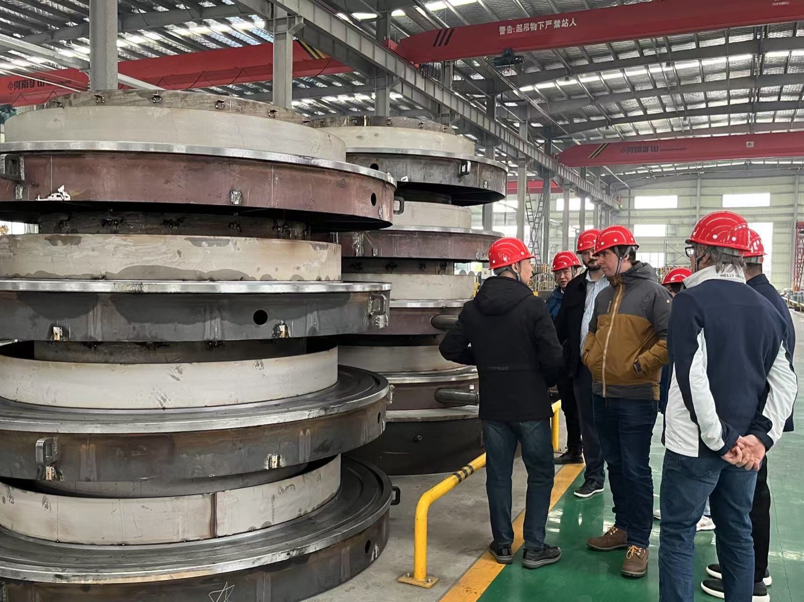 Customer representatives reviewing furnace components during a factory audit at Hengyuan.