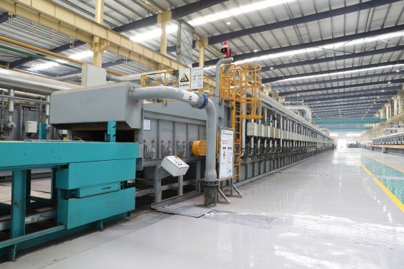 Continuous heat-treatment line shown as background to the 2022 accreditation